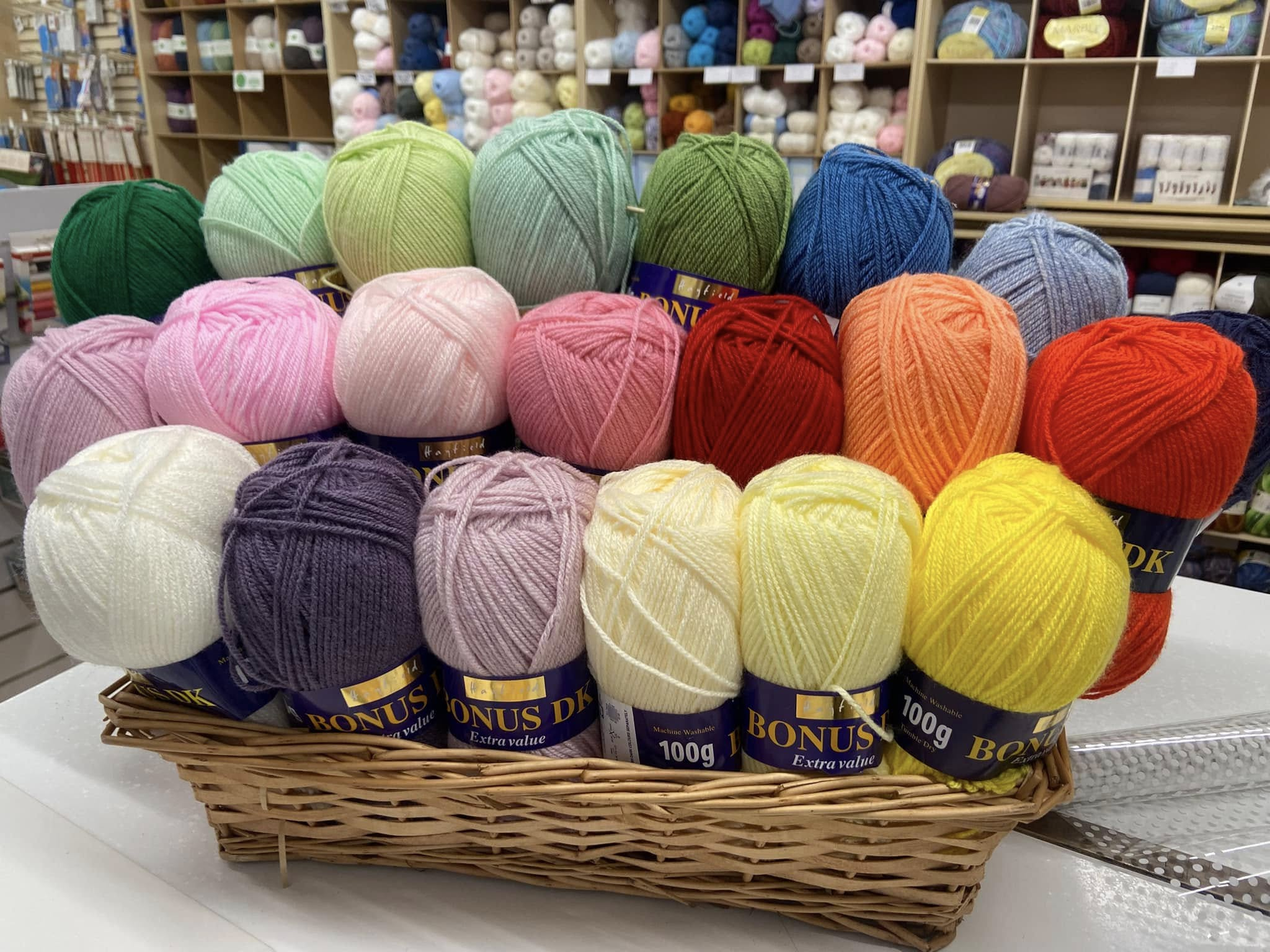 Basket of colourful knitting yarn